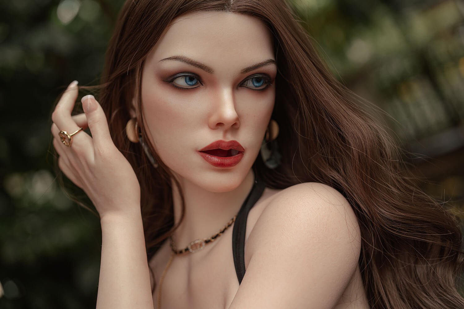 Close-up portrait of a woman with blue eyes, long brown hair, and red lipstick, looking to the side.