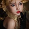 Close-up of a mannequin/doll with blue eyes, red lips, blonde hair, and a gold halo-style headpiece with star charms.