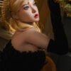 Close-up portrait of a woman with blonde hair wearing a gold sunburst headpiece and black velvet gloves, reaching toward yellow flowers.